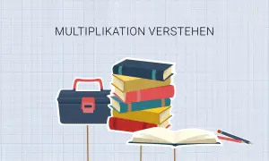 Werkzeugkasten, Bücherstapel und ein offenes Buch mit Stiften. Die **Multiplikation** wird hier bildlich erklärt.
