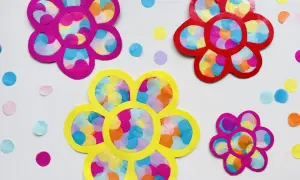 Bunte Blumen basteln Kinder einfach: Papierblumen mit Krepppapier-Konfetti.