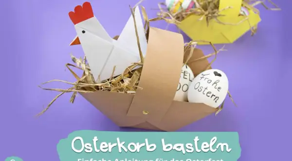 Osterkorb basteln: Ein Origami-Huhn sitzt in einem selbstgemachten Korb mit Stroh und Ostereiern. Einfache Anleitung für das Osterfest.